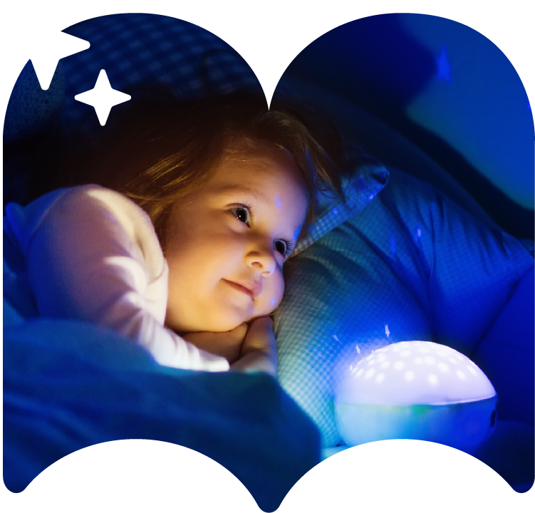 A child tucked up beside a glowing star projector, framed in the Little Night Stories book shape